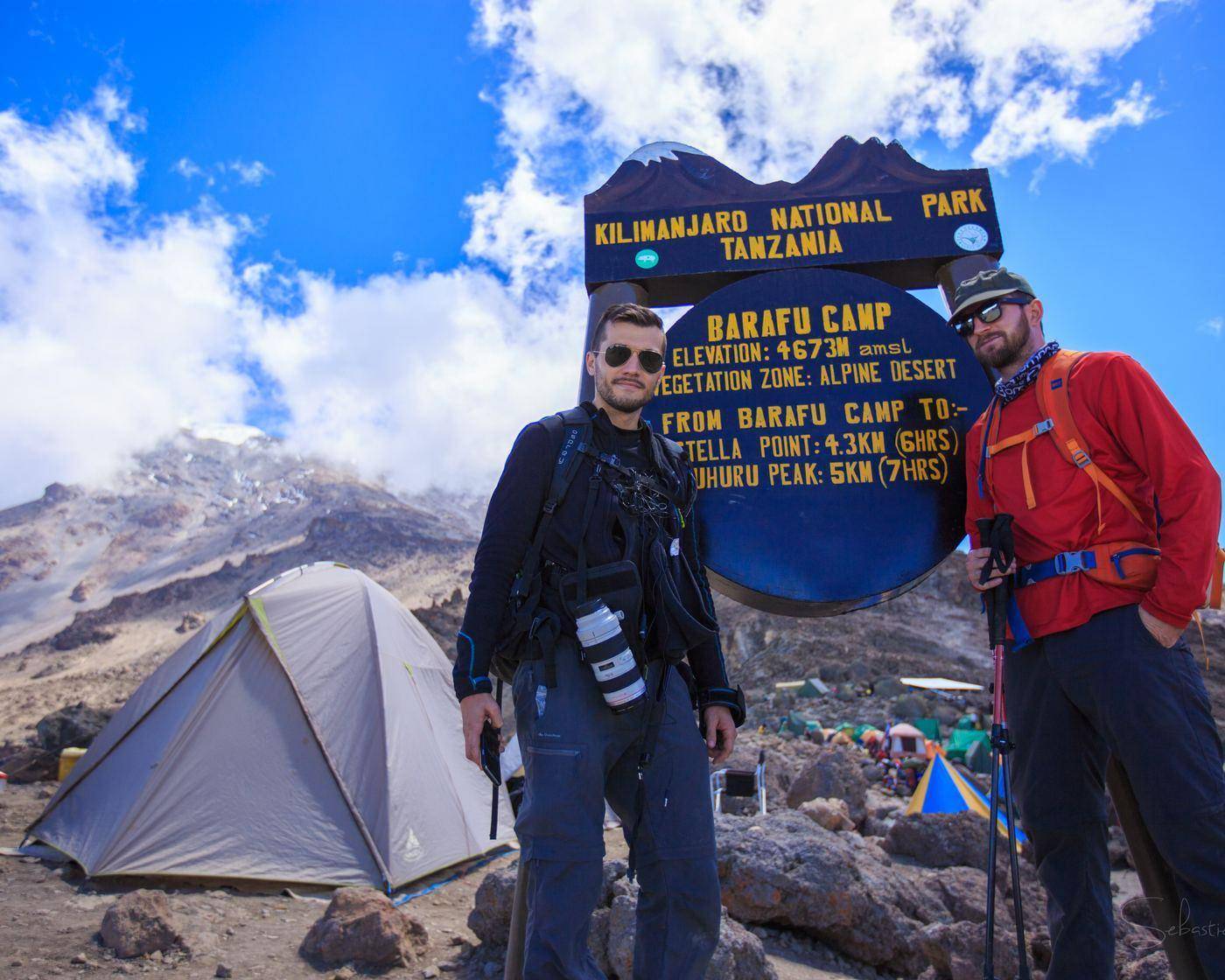 Barafu climbers at the Barafu Camp sign, 4,673 m