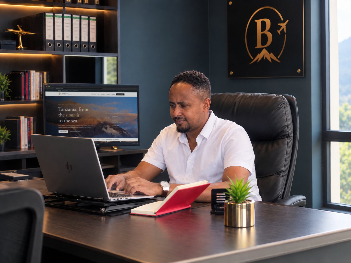 Chance Liganga, founder and CEO of Barafu Tours, in the Barafu office in Arusha